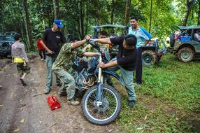 Motorcycle Mechanic in forest