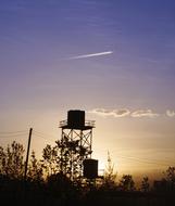 tower near trees at dusk