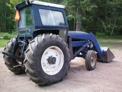 blue tractor with bucket