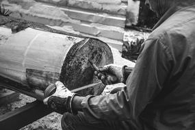 worker with wood in black and white background