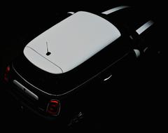 black car with white roof in the dark