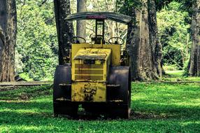 road roller on a green lawn