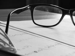glasses on papers for work