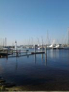 sailboats in the port under the blue sky