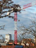 Crane, among the colorful buildings in Ulm, under the blue sky with white clouds