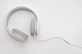 new white headphones on white surface