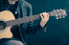 Guitar Classical Acoustic in the hands of a young man