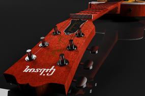 brown guitar head on black background