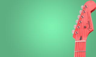 red head of Guitar at green background