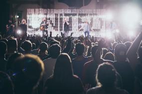 a crowd of people near the stage at a concert