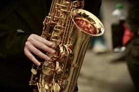 brilliant saxophone in the hands of a musician