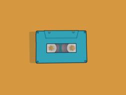 music cassette on orange background