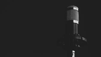 photo of a professional microphone in a dark room