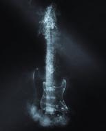 smoke around electric guitar at darkness