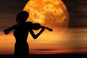 silhouette of a girl playing the violin on a background of the yellow moon