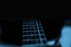 guitar on dark in blurred background