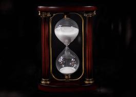 hourglass in a wooden stand