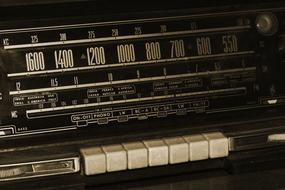 macro photo of a retro radio with white buttons