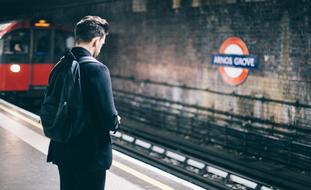 man with a backpack at the station