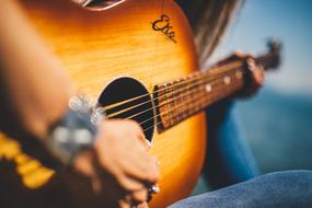 girl in jeans plays Guitar