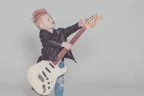 photo of boy rock guitarist