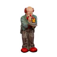 Cute and colorful figure of the clown, with the make-up, at white background