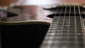 Guitar strings and body, soft focus, detail