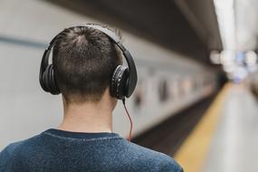 back view of Guy with headphone