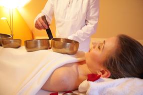 singing bowl massage in massage parlor