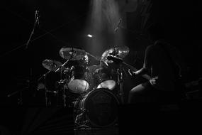 dark photo of a rock drummer
