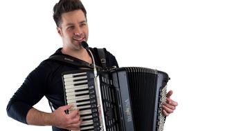 happy young man plays accordion