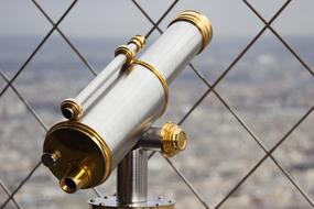 macro photo of a metal telescope on the observation deck