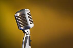 vintage silver Microphone at bronze color background