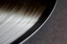Close-up of the beautiful, shiny, black vinyl on the record