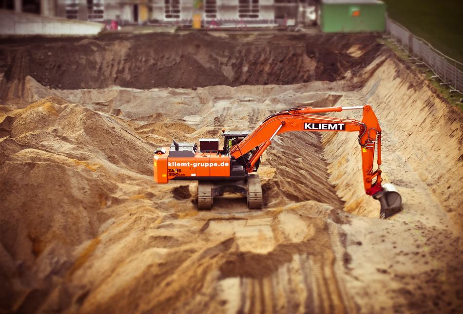 photo of an excavator on a sand quarry