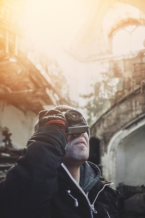 Photographer, with the camera, in the colorful and beautiful light