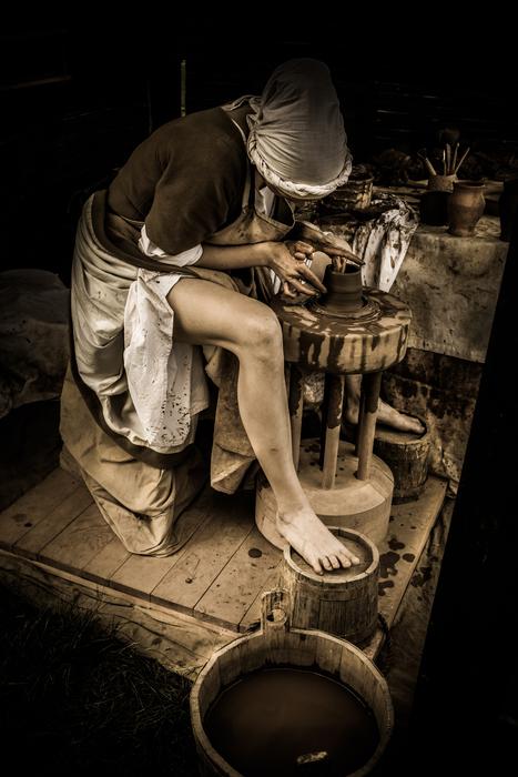 potter, girl in Medieval clothing working