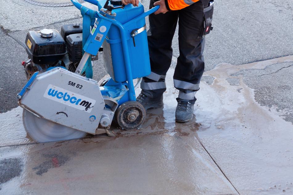 road workers in work clothes on the street