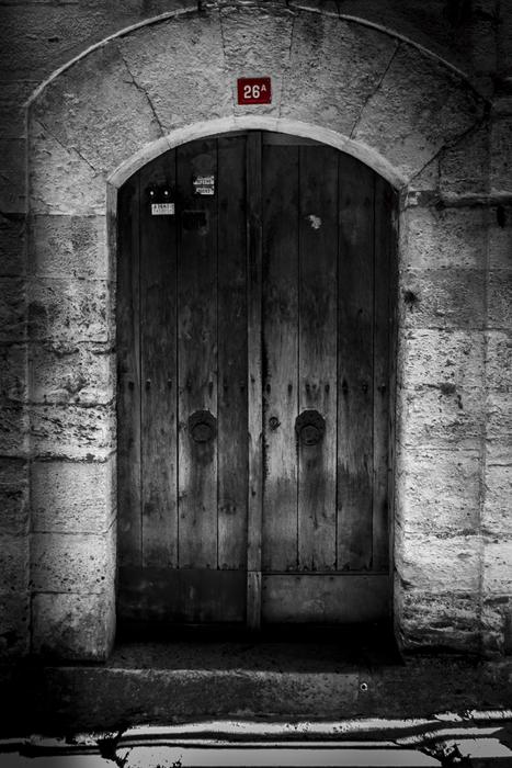 black and white photo of the door to the castle