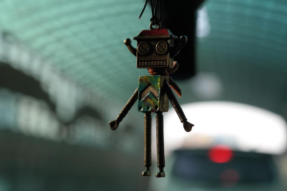 Close-up of the cute, colorful robot, at blurred background