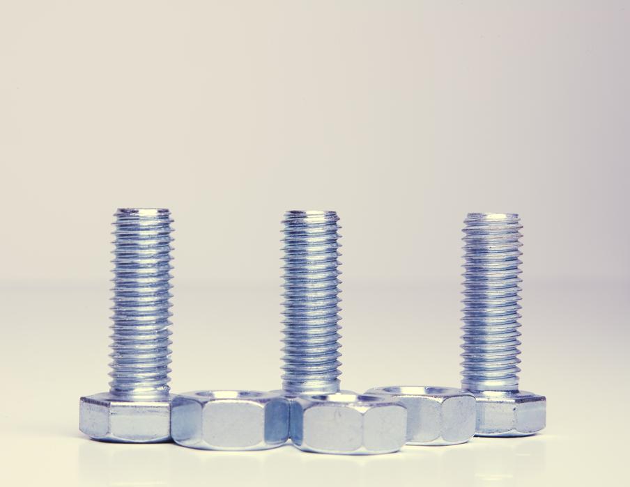 chrome screw and nut on white background