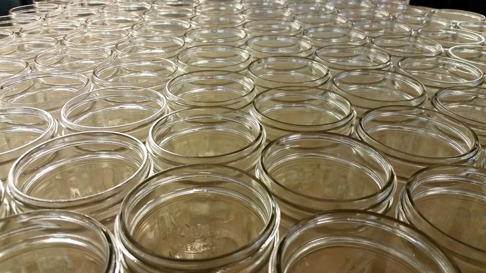 Top view of the shiny, industrial glass jars