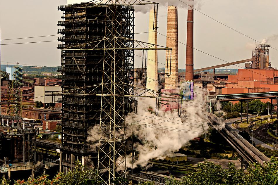 steam from an industrial plant in the afternoon