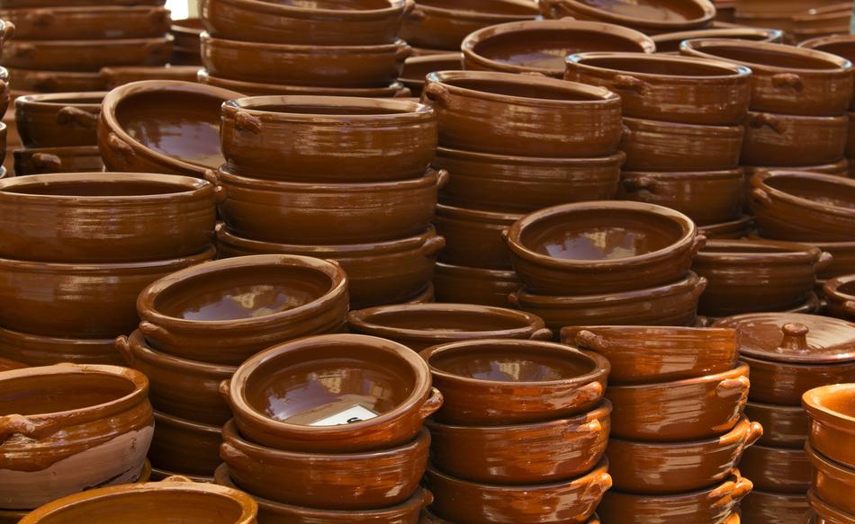 Beautiful, shiny, brown ceramic casseroles in towers