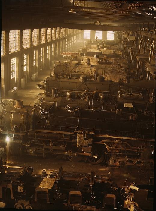 Old, retro photo with the beautiful locomotive shop in light