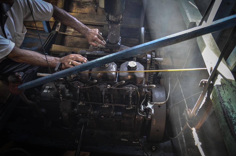 Worker near the engine of the boat