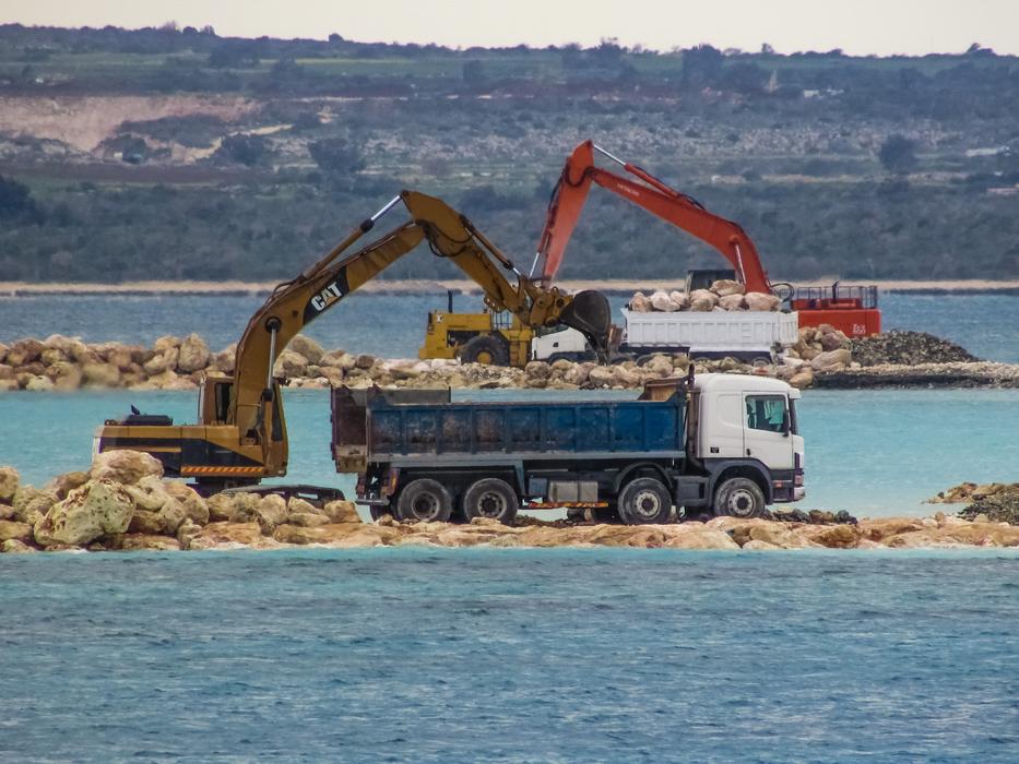 excavators next to a truck in cyprus