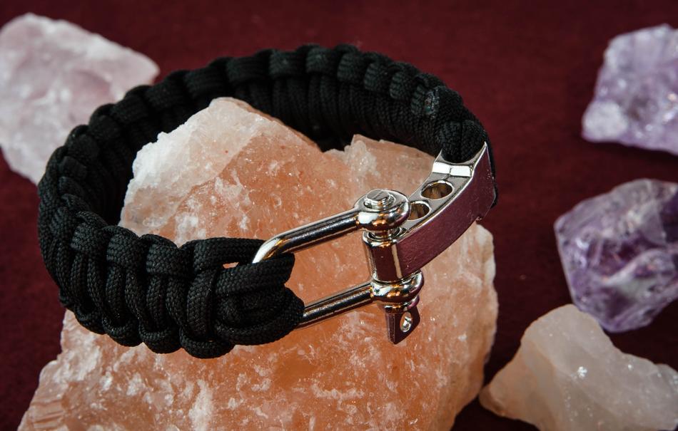 Black and metal bracelet on the beautiful and colorful minerals