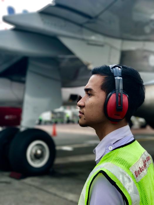 technician stands on the runway