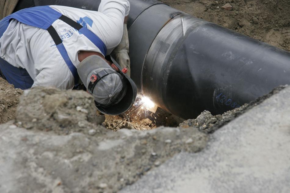workers will weld a pipe underground